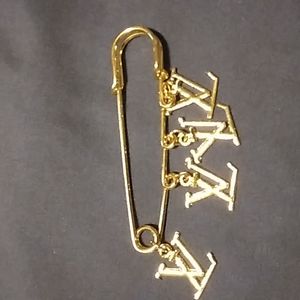 Safety pin brooches